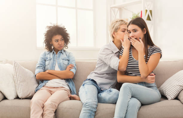 istock Young woman telling her friend some secrets 997697354