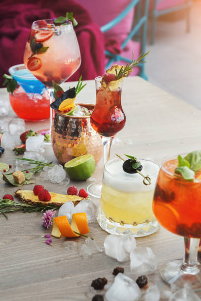 istock Colorful cocktails over rustic wood background 997698376