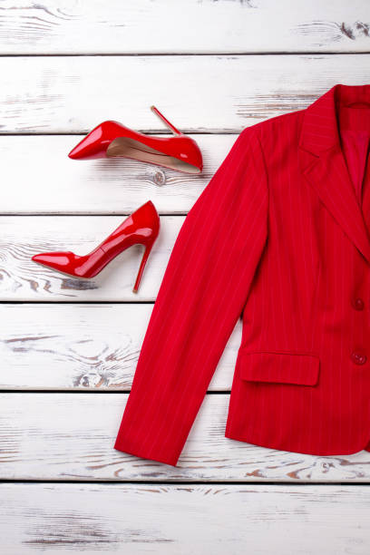 istock Red female suit jacket and high heel shoes. 997698632