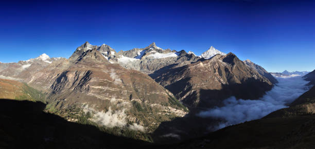 Alps mountains at morning in blue sky, Switzerland.