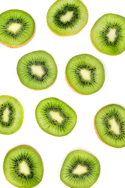 istock Kiwi fruit Slices macro.  Ripe Kiwi fruit isolated on white background. Fresh tropical abstract background 997709710