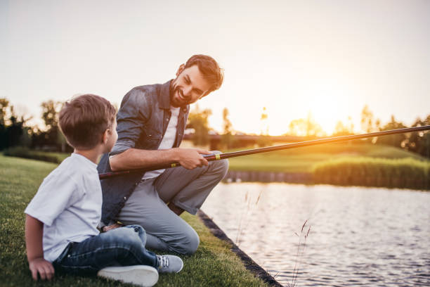 istock Dad and son are fishing 997710910