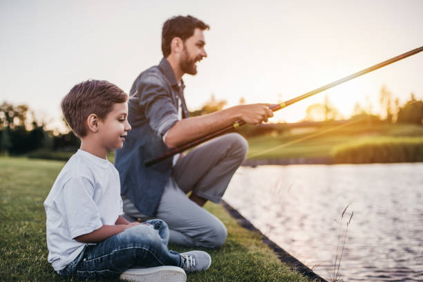 istock Dad and son are fishing 997710912