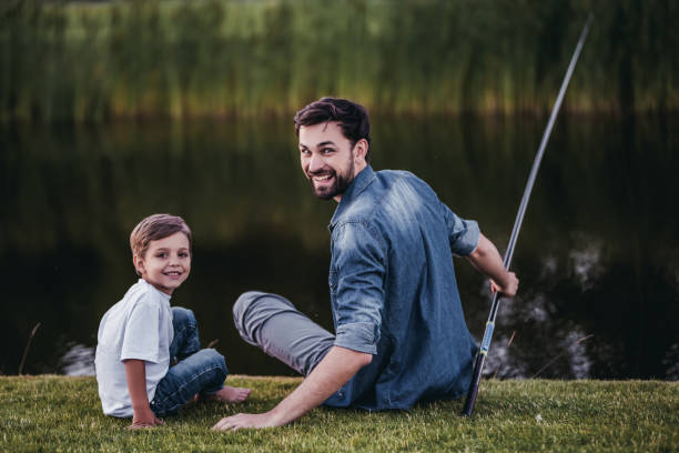 istock Dad and son are fishing 997711028