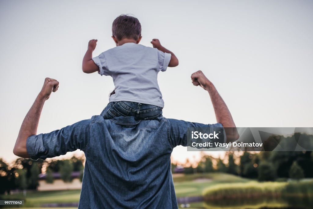 Dad and son outdoors Dad and son having fun outdoors. Father Stock Photo