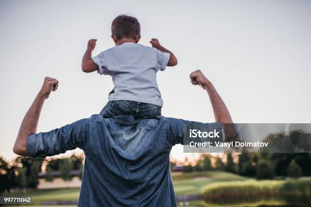 Dad And Son Outdoors Stock Photo - Download Image Now - Father, Child, Healthy Lifestyle