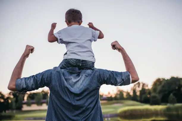 Photo of Dad and son outdoors