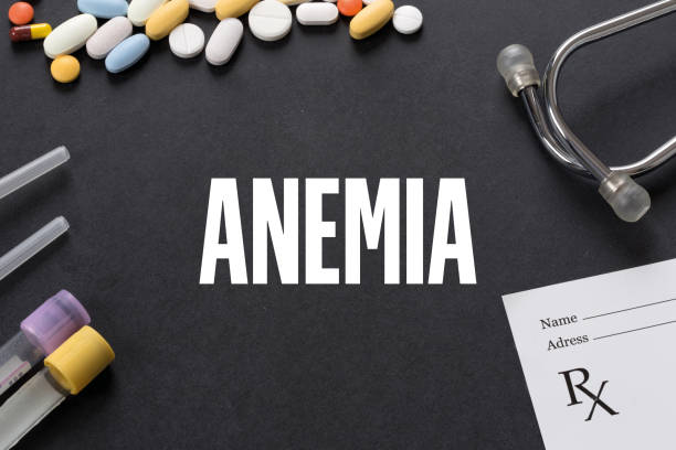 istock ANEMIA written on black background with medication 997713764
