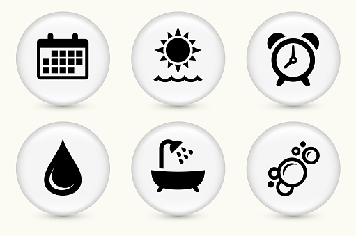 Morning Appointment Icon Set. The icon is white and is placed on a round vector button. The button is light in color and the background is light as well. The composition is simple and elegant. There is a small shadow under the button. The vector icon is the most prominent part if this illustration.