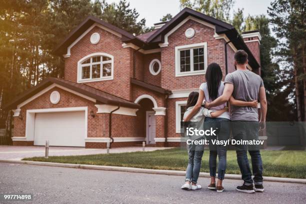 Happy Family Outdoors Stock Photo - Download Image Now - House, Family, Residential Building