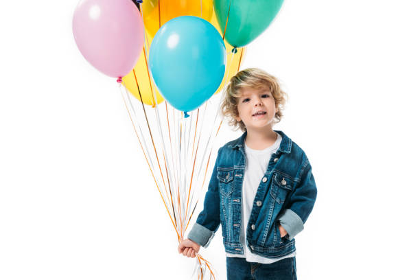 istock adorable boy with bundle of balloons isolated on white 997723800