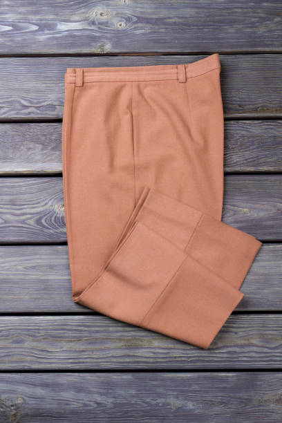 istock Folded beige business trousers. 997725426