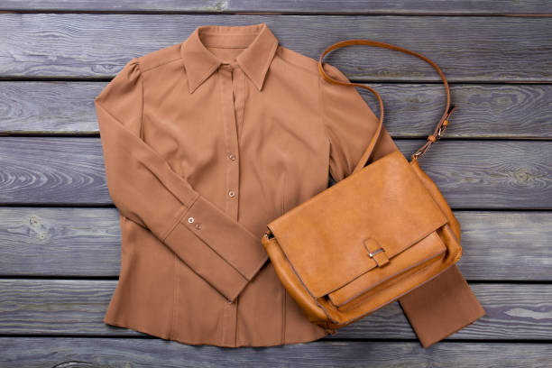 istock Brown shirt and purse. 997725638