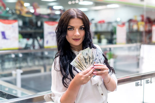 istock Beautiful brunette going make big shopping in mall 997728094
