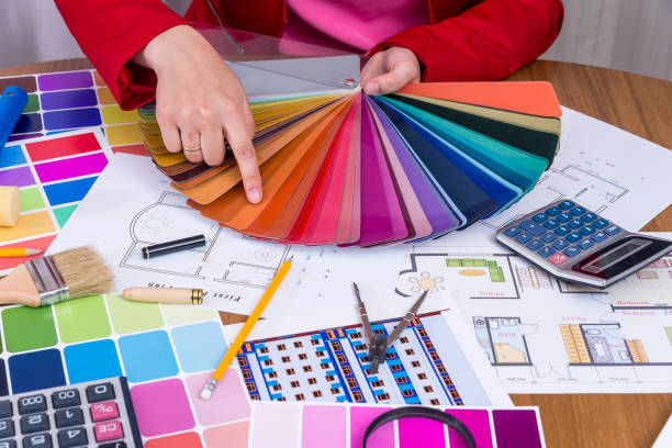 istock Designer hands with colour swatch choosing color 997737148