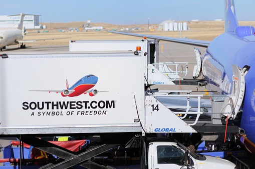 Denver, Colorado, USA - November 17, 2011: Southwest airlines plane being serviced at the Denver International Airport in Denver, Colorado.