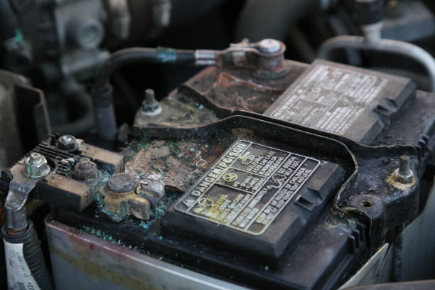 Coroded car battery Damaged and coroded car battery danger car battery stock pictures, royalty-free photos & images