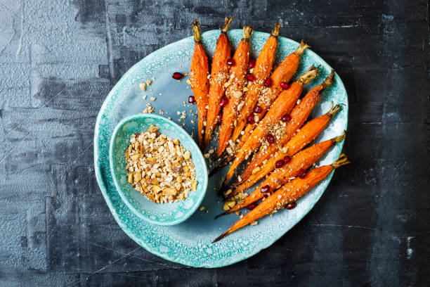 istock Roasted carrots with dukkah. Vegetarian food. Top view, flat lay, copy space 997745648