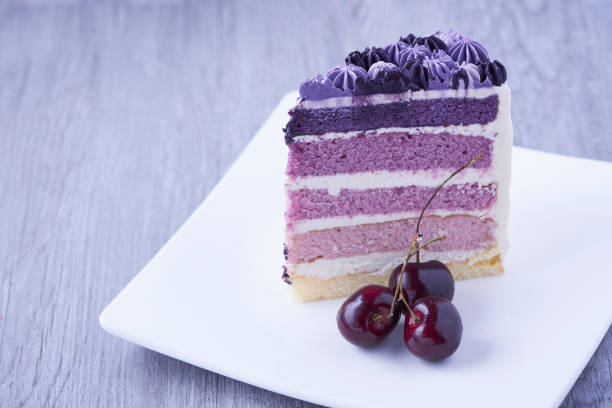 A piece of  purple cake on the table