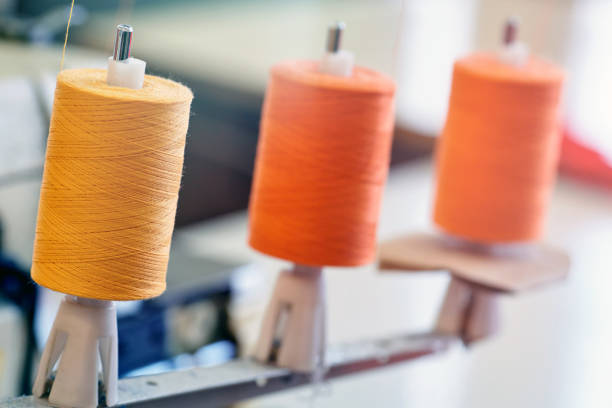 closeup of three threadlike coils for industrial sewing machine - nylon strings imagens e fotografias de stock