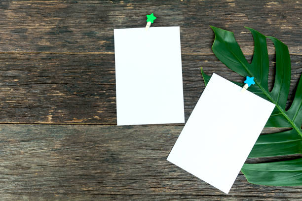 istock Blank squared notepad pages and the paper clip. Note paper stuck with paper clip. 997752248