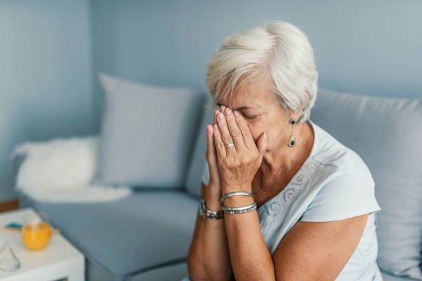 istock A solemn elderly woman sitting on her bed dealing with depression 997761974