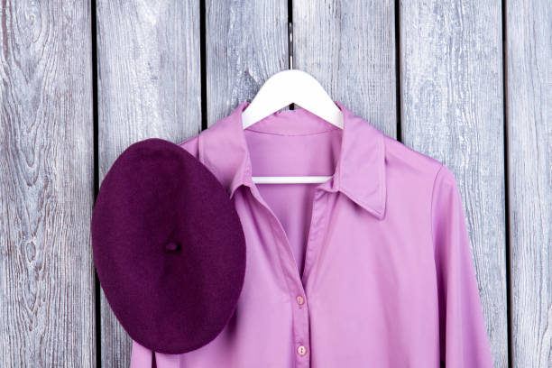 istock Close up purple shirt and hat, flatlay. 997779300