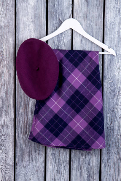 istock Purple skirt and beret hat, flat lay. 997784358