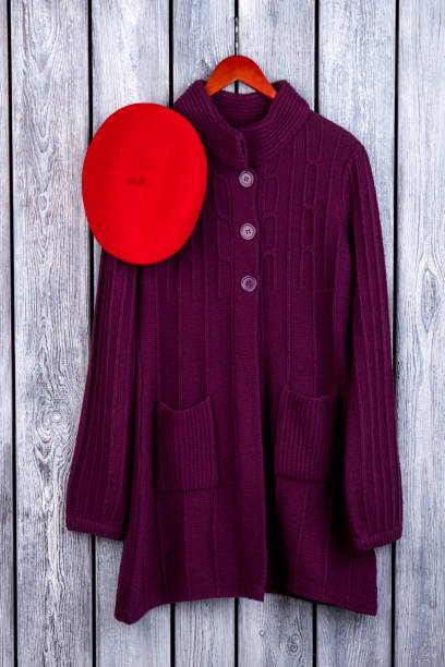 istock Burgundy wool cardigan and red beret hat. 997784870