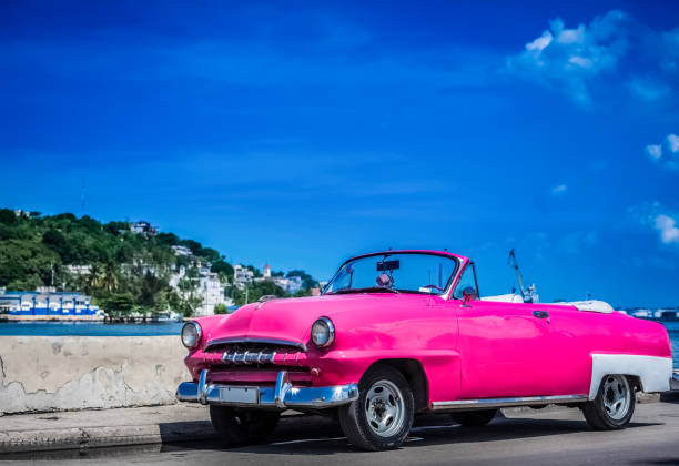 HDR - American pink vintage convertible car parked on the Malecon in Havana Cuba - Serie Cuba Reportage stock photo