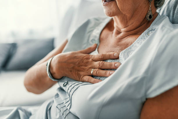 Female with chest pain Female with chest pain. Senior woman suffering from heartburn or chest discomfort symptoms. Acid reflux or Gastroesophageal reflux disease (GERD) concept coronary artery photos stock pictures, royalty-free photos & images
