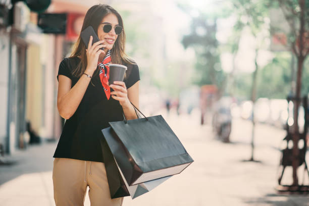 istock Woman walking down the street. 997797388