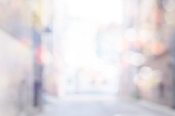 istock abstract blur background of empty street in town 997802636