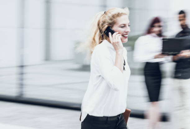 istock Businesswoman on The Phone, Blurred Motion 997802640