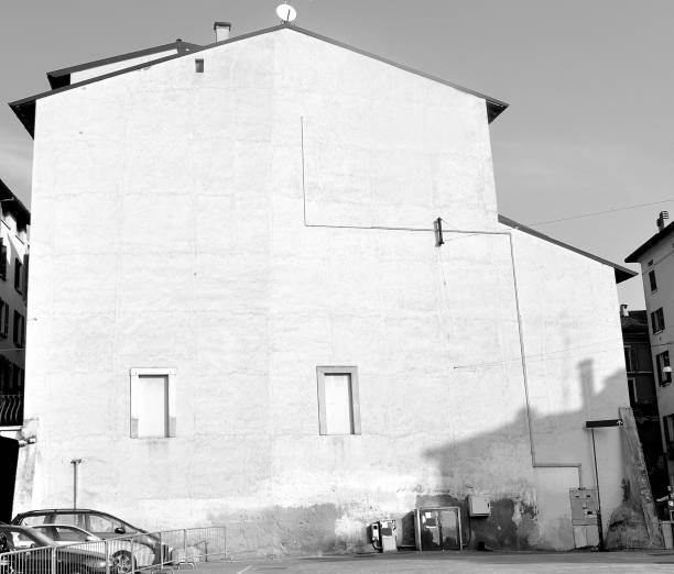 istock Black and white isolated house with empty illuminated wall. Useful as signboard. 997803078