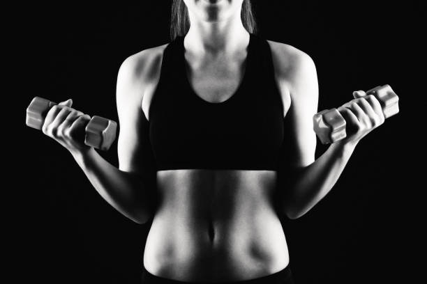 istock Fitness woman on black background 997817880