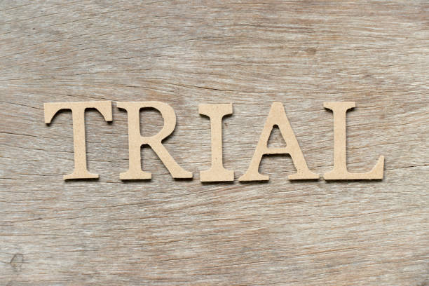 istock Alphabet letter in word trial on wood background 997826218