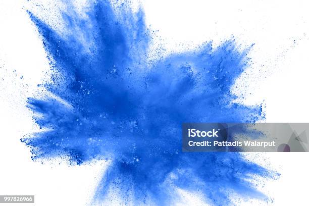 Abstract Explosion Of Blue Dust On White Background Abstract Blue Powder Splatter On Clear Background Freeze Motion Of Blue Powder Splashing Stock Photo - Download Image Now