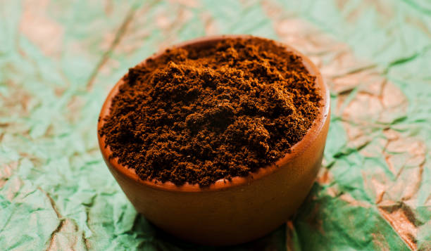 istock Fresh-ground coffee beans.Coffee beans on wooden texture. 997831186