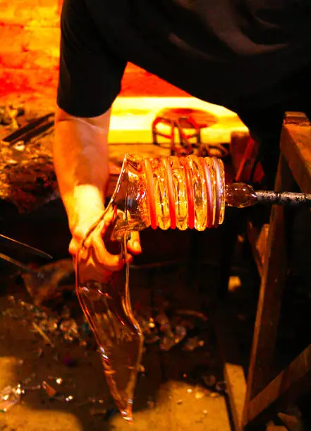 The process of making a glass combined with copper.