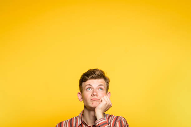 istock bored disinterested indifferent man look up chin 997836166