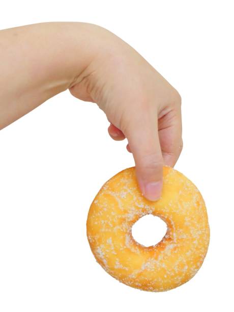 istock Hand Holding Delicious Glazed Donut with Sugar 997884824