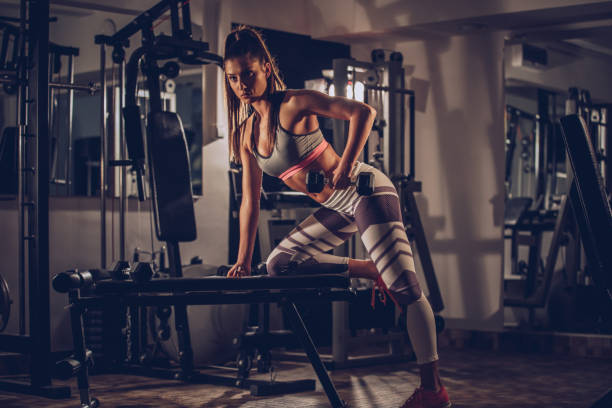istock Woman training with dumbbell 997890494