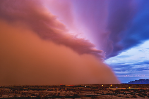 A dramatic dust storm (Haboob) along the leading edge of severe, monsoon thunderstorms, moves across the Arizona desert near Yuma.