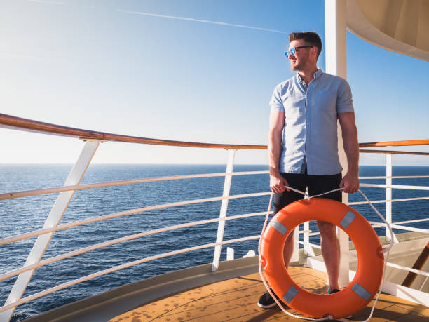 Male hand holding orange lifebuoy