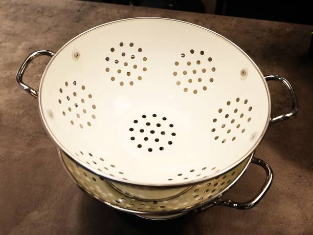 istock Stack of Metal Bowls on A Wooden Table 997899038