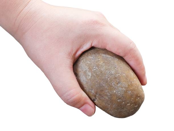 istock Hand Holding A Pieces of Pebble Rock 997899392