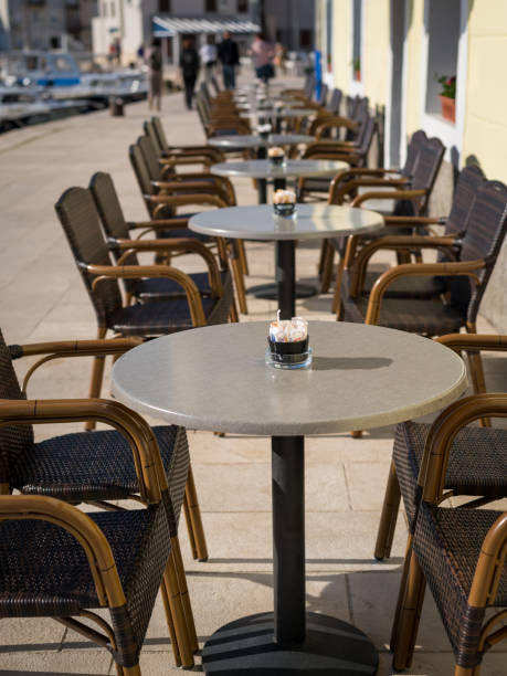 istock Empty tables and chairs of a cafe 997900274