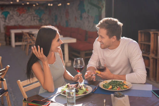 istock Smiling blonde-haired man telling jokes his girlfriend 997938538