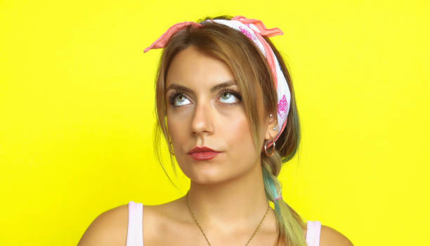 istock Thoughtful girl pointing up 997941426
